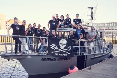 A group of people posing on the Emanuel Bronner ship