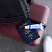 Travel-size toothpaste on top of a passport