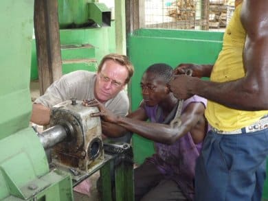 Two men working on a machine