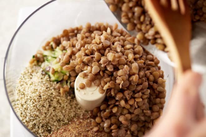 Putting lentils and other ingredients into a food processor