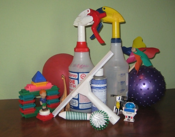 A collection of household cleaners and toys