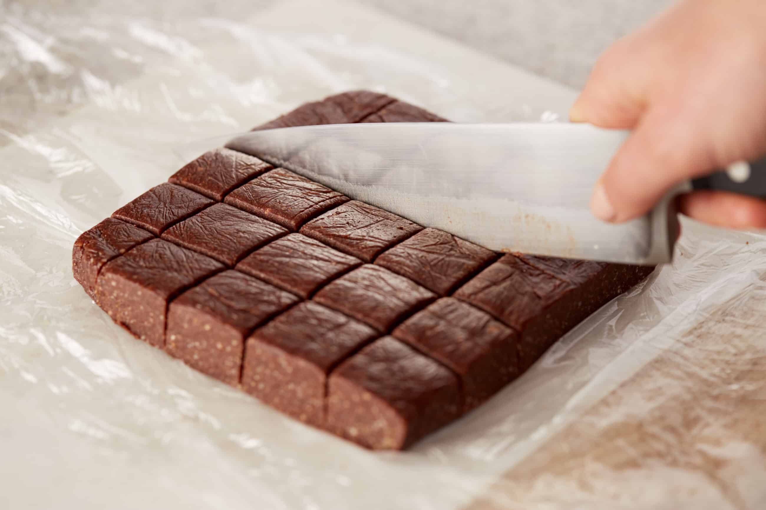 Dividing the brownies up with a knife