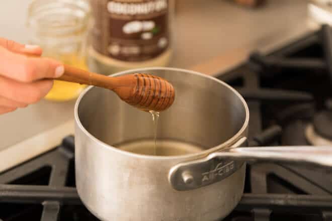 Melting honey in pot