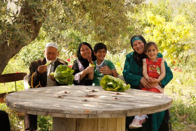 Palestinian family enjoying a break in their olive grove
