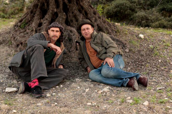 David Bronner and Nasser Abufarha under an olive tree