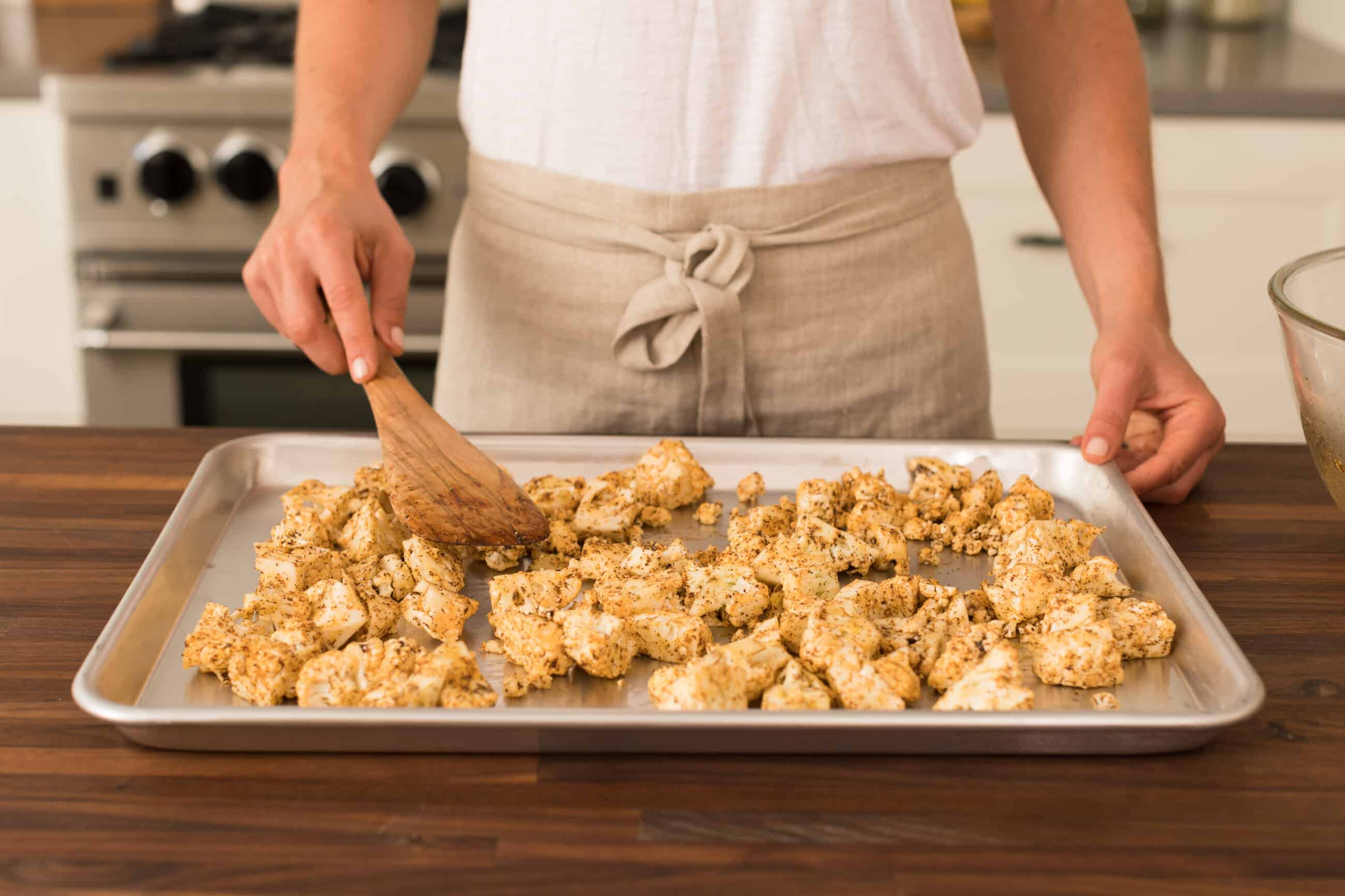 Play cauliflower in a single layer onto a baking pan