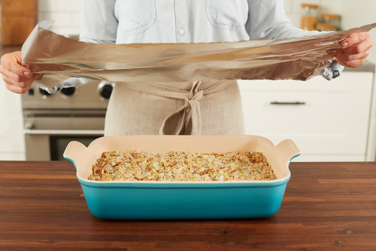 Cover the baking dish tightly with aluminum foil